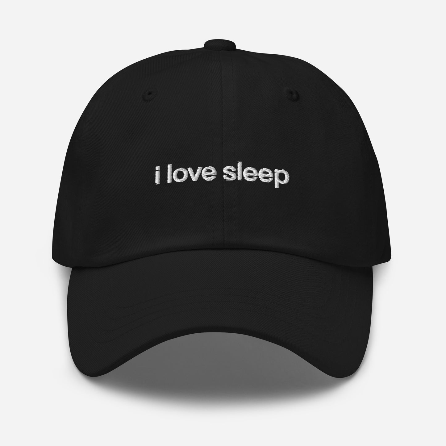 Black I Love Sleep dad hat with embroidered lettering and adjustable strap.