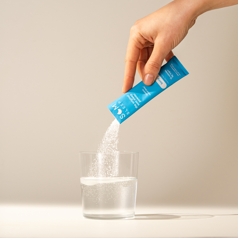 Som Sleep Blue Berry Powder Stick Poured Into a Glass of Water